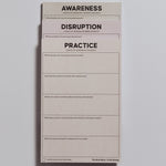 Three half letter notepads stacked with bold titles Awareness Disruption and Practice for personal growth