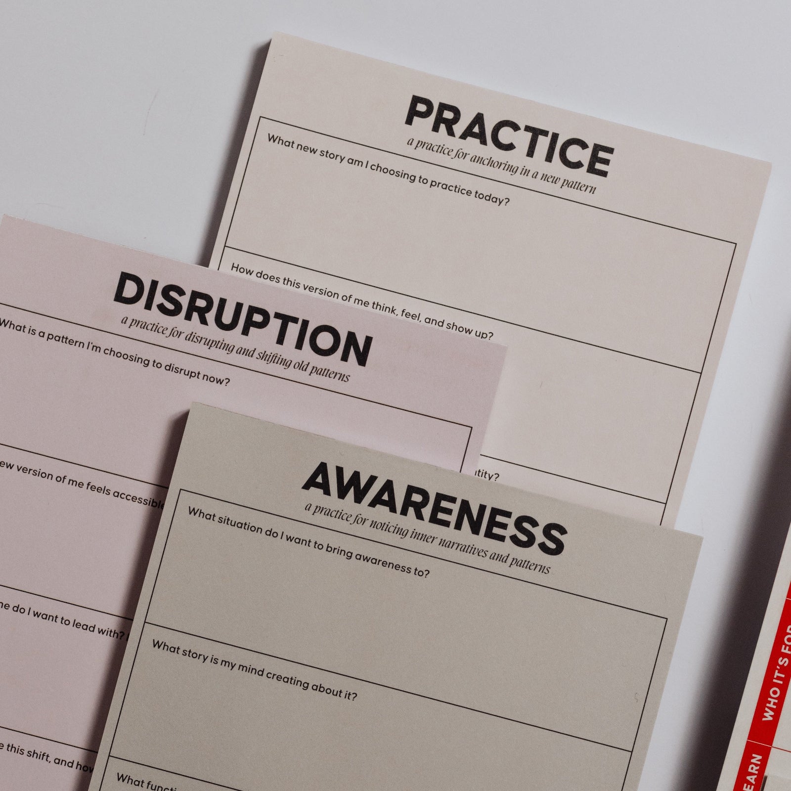 Pastel trio of plain notepads labeled Practice Disruption Awareness for personal growth.