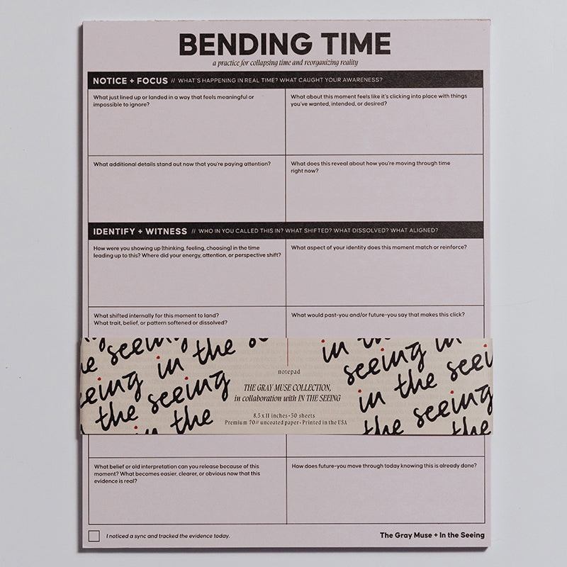 Bending Time Notepad with pale pink cover, four quadrant prompts, and a decorative wraparound band.