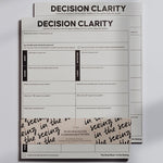 Two overlapping Decision Clarity Notepads with a bold DECISION CLARITY header and a grid of prompts