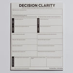 Top down view of a Decision Clarity Notepad with a decorative wrap along the bottom edge