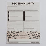 Decision Clarity notepad displaying guided decision prompts and sections labeled body signs intuition logic.