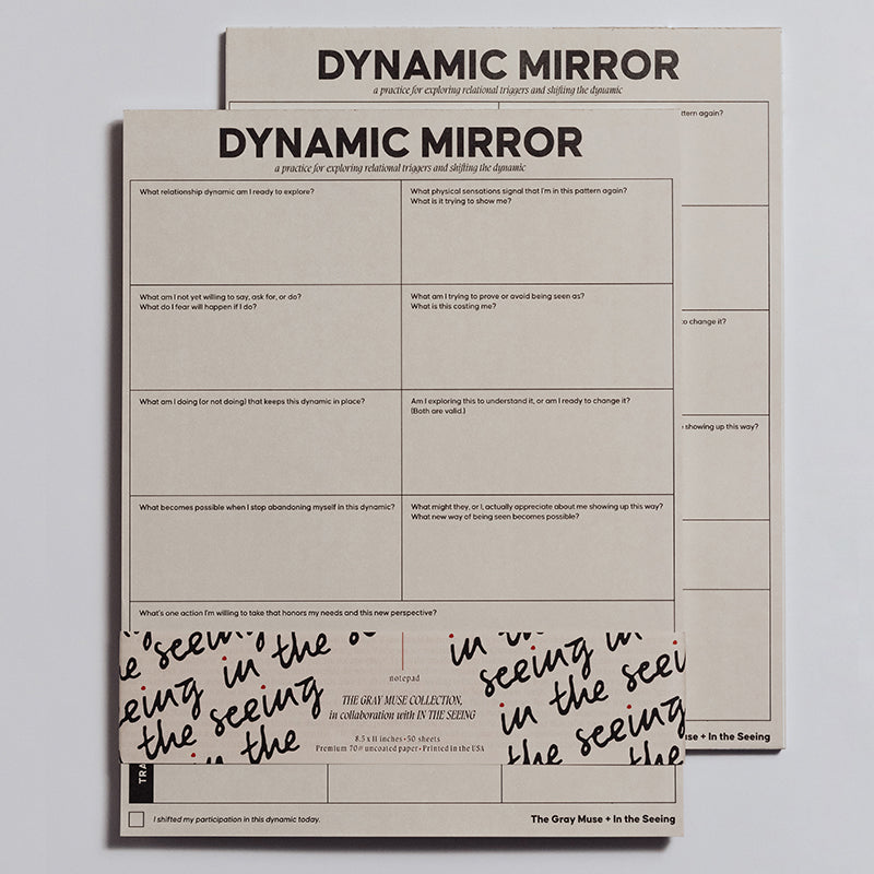 Dynamic Mirror Notepad on a light surface with a second sheet behind and the bold title at the top