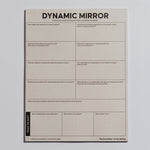 Dynamic Mirror Notepad on a light background with track the shift text along the left edge and decorative packaging at the bottom