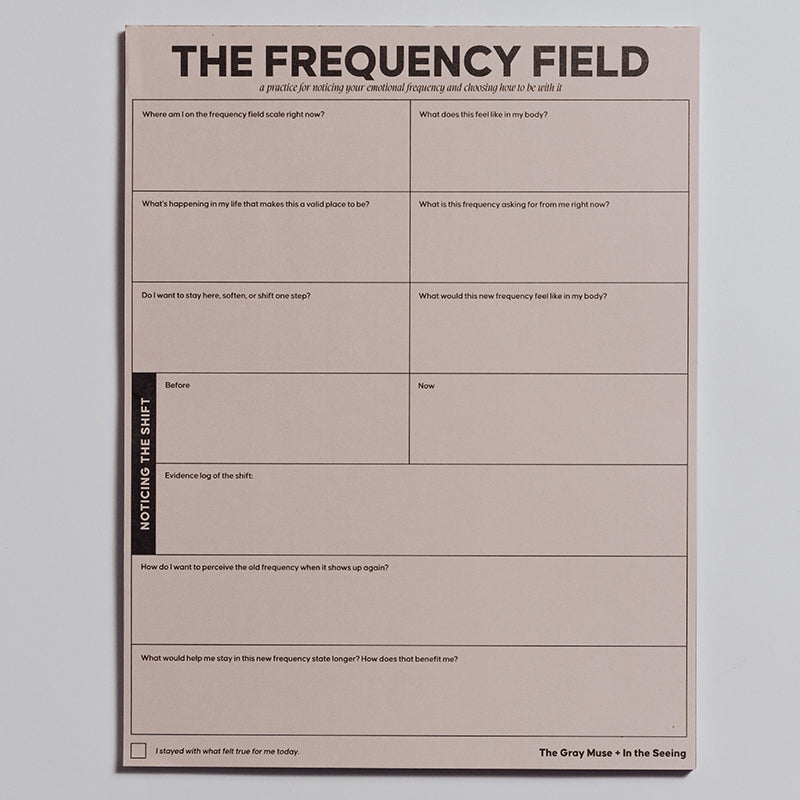 The Frequency Field Notepad displayed upright with a decorative wrap around the lower portion.