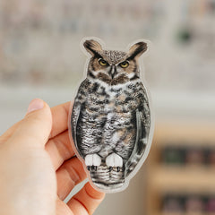 Great Horned Owl matte sticker held between fingers showing its 4.1 inches tall design