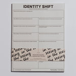 Identity Shift Notepad stacked with a decorative wrap across the lower edge