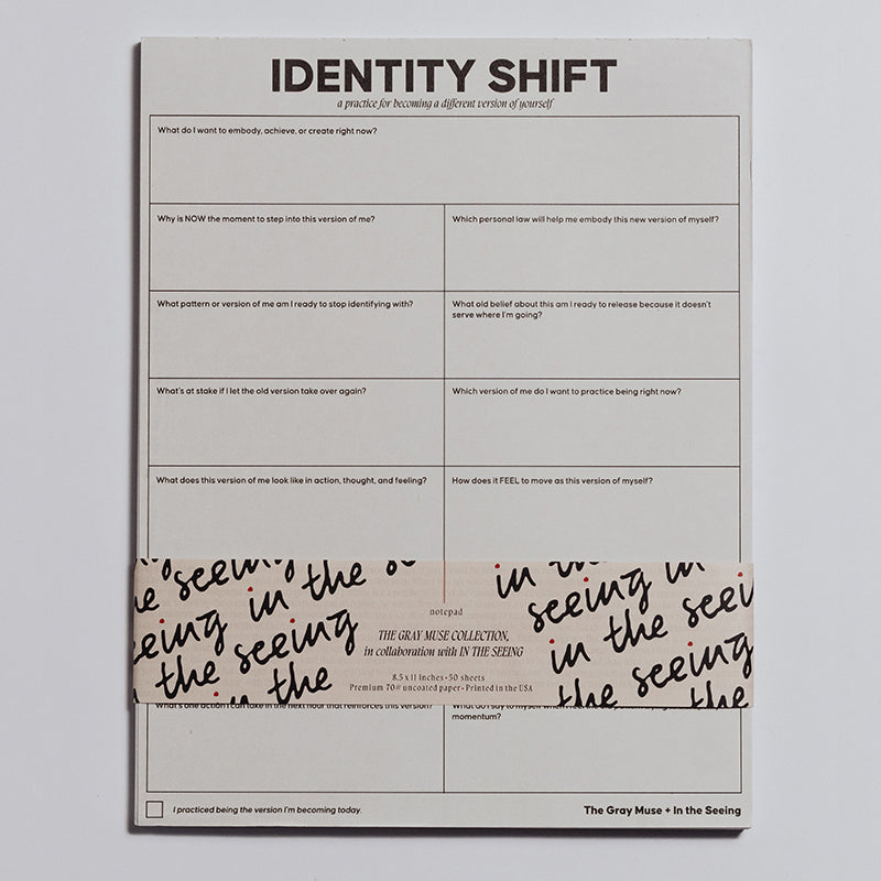 Identity Shift Notepad stacked with a decorative wrap across the lower edge