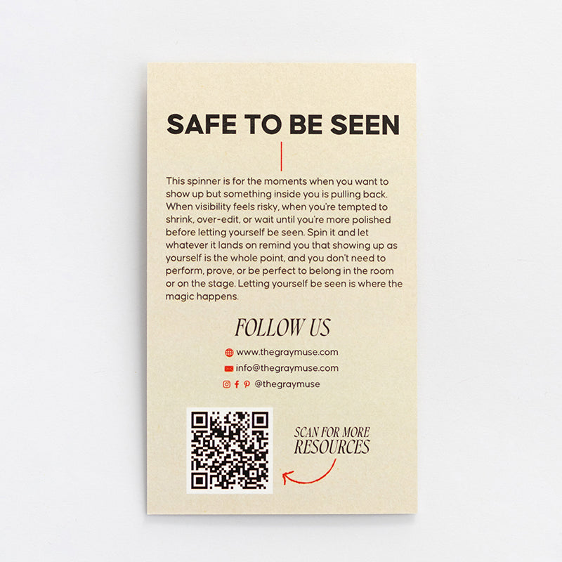 Beige card for the Safe to Be Seen spinner featuring bold heading, descriptive text, a QR code, and social resources