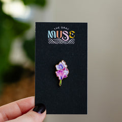 Sweet Pea enamel pin on a black display card with The Gray Muse logo