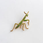 Praying Mantis enamel pin on white background with green and gold detailing; state insect of CT and SC.