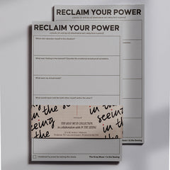 Reclaim Your Power notepad stack with bold title on the top sheet and a decorative wraparound band visible.