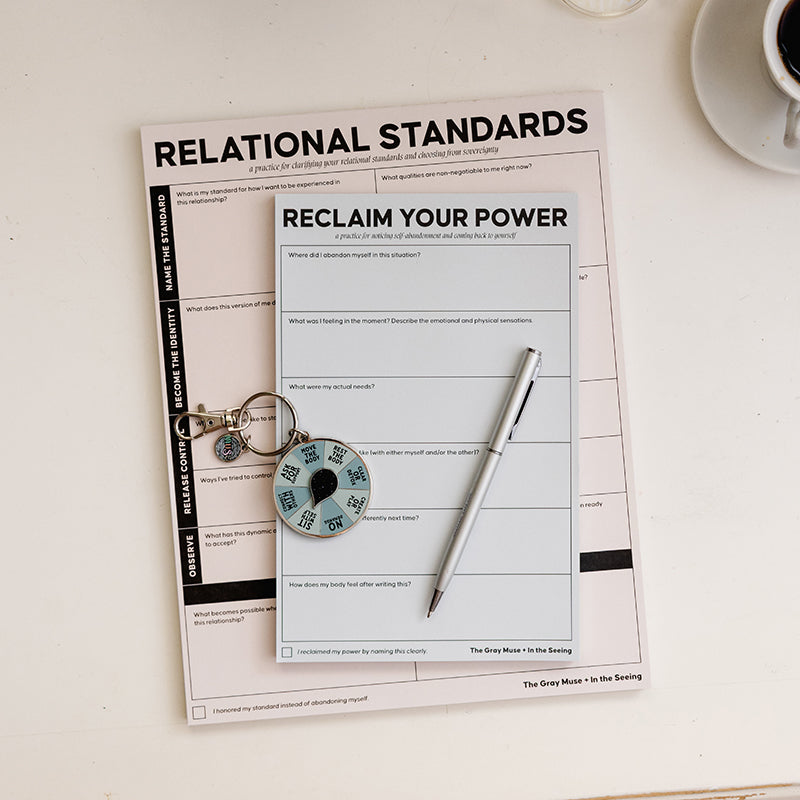 Staying with Yourself Bundle arranged with Relational Standards Notepad Reclaim Your Power Notepad a teal My Needs Spinner and a decorative wrap on a light surface.